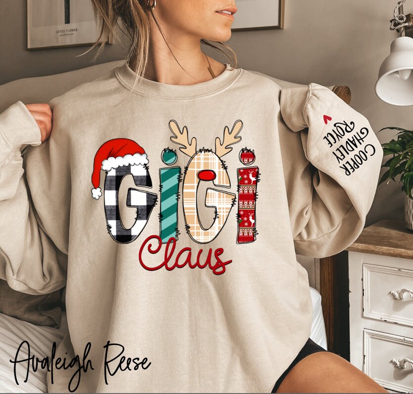 Custom Gigi Claus Sweatshirt, Christmas Grandma Claus Sweatshirt, Grandma Sweater, Custom Nana And Grandkids Sweatshirt Sleeve Print